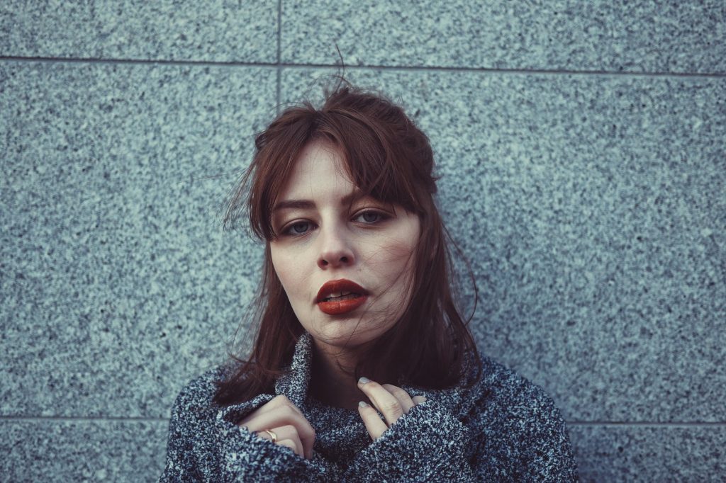 woman in gray sweater