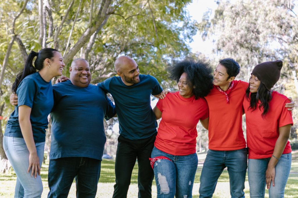 group of people wearing blue and red shirts