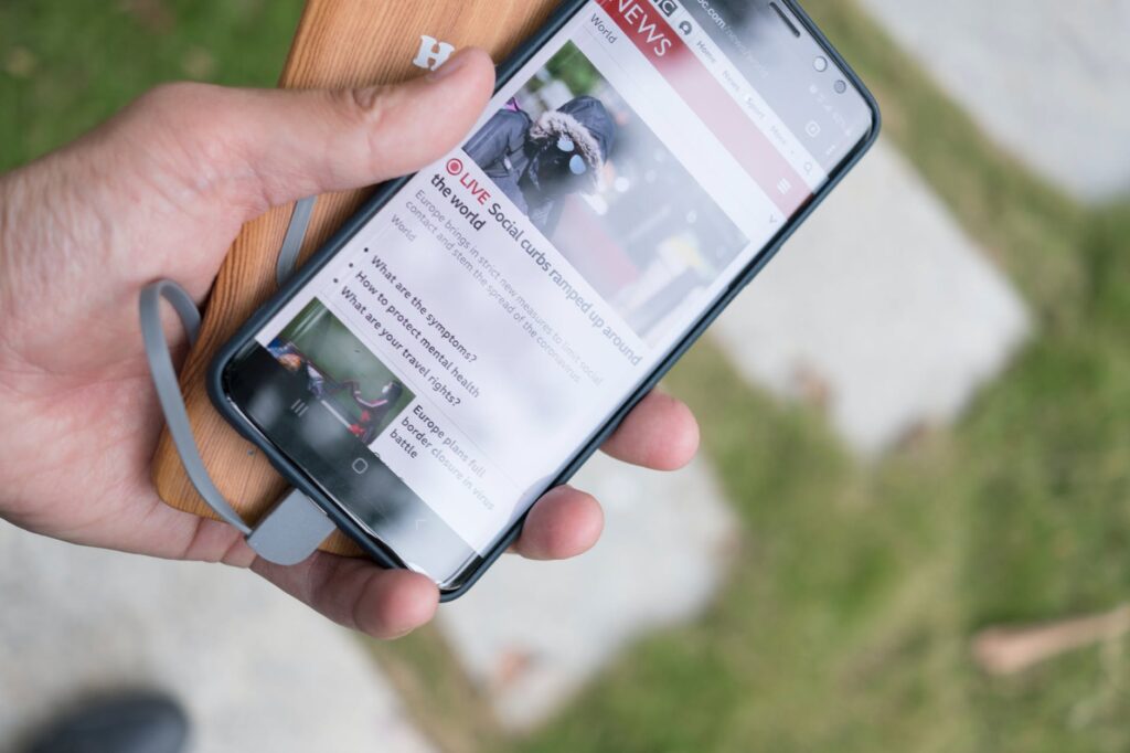 person holding black samsung android smartphone